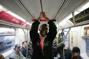 Happy passenger on the 2 line, NYC